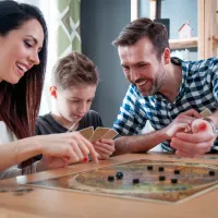 family playing a board game inside their Springfield home