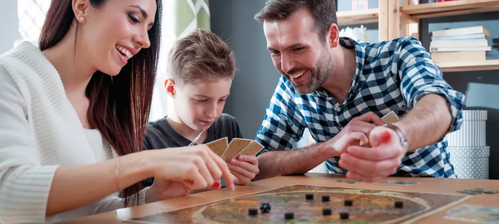family playing a board game inside their Springfield home